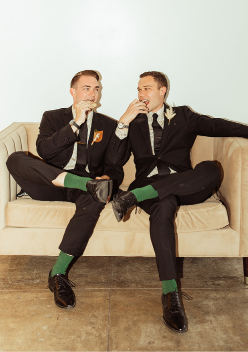 LGBTQ couple laughing together on the “Better Together” couch lounge at FruitCraft.