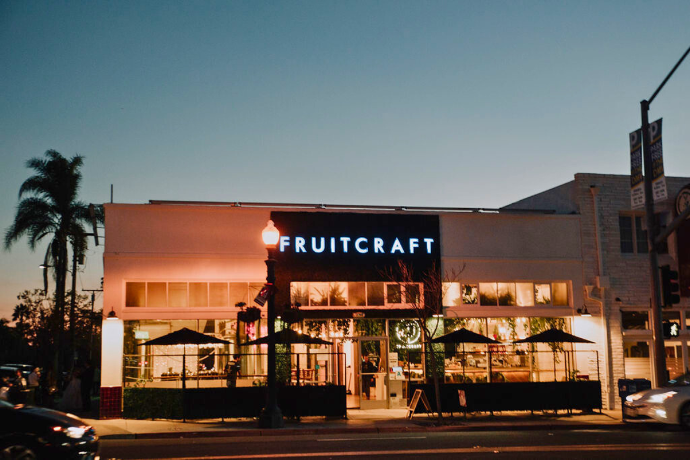 FruitCraft building illuminated at night in San Diego