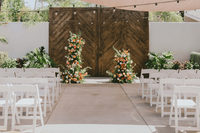 Ceremony setup with floral arrangements at FruitCraft venue